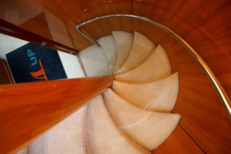 Fins Up Yacht Photos Pics Spiral staircase on 2006 Sunseeker Manhattan Motor 82 yacht interior.