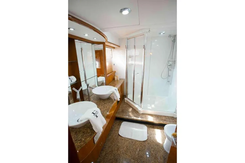 Fins Up Yacht Photos Pics Luxurious bathroom in 2006 Sunseeker Manhattan Motor 82 yacht with dual sinks and shower.