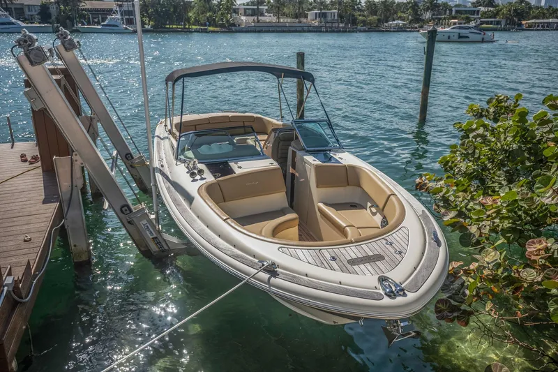 Chris-craft Launch 32 Yacht Photos Pics 2013 Chris-Craft Launch 32 boat docked on clear blue water.