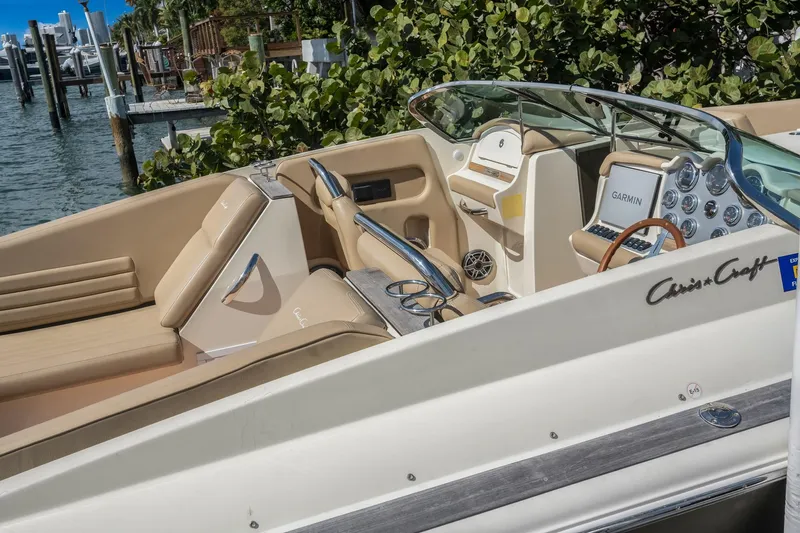 Chris-craft Launch 32 Yacht Photos Pics 2013 Chris-Craft Launch 32 boat interior with beige seating and Garmin navigation system.