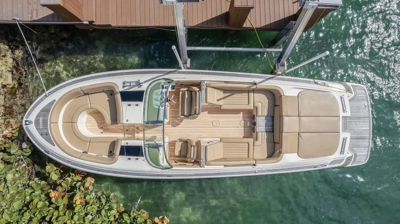 Chris-craft Launch 32 Yacht Photos Pics 2013 Chris-Craft Launch 32 boat docked, aerial view, showcasing elegant design and spacious seating.