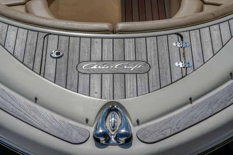 Chris-craft Launch 32 Yacht Photos Pics 2013 Chris-Craft Launch 32 boat deck with logo and wood finish.