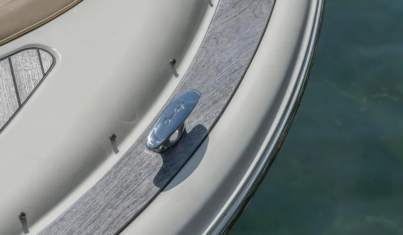 Chris-craft Launch 32 Yacht Photos Pics 2013 Chris-Craft Launch 32 boat detail with cleat on deck, near water.