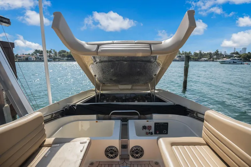 Chris-craft Launch 32 Yacht Photos Pics 2013 Chris-Craft Launch 32 boat interior with open engine hatch, docked by the water.
