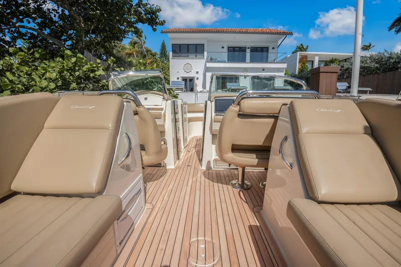 Chris-craft Launch 32 Yacht Photos Pics 2013 Chris-Craft Launch 32 boat interior with tan seating and wooden deck.