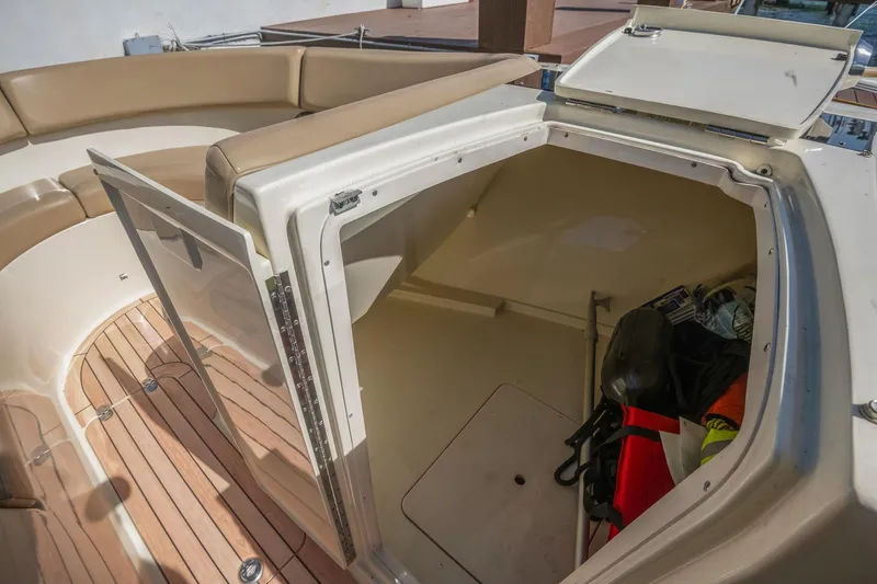 Chris-craft Launch 32 Yacht Photos Pics 2013 Chris-Craft Launch 32 boat interior with open storage compartment and seating area.