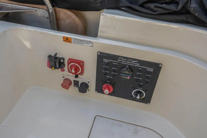 Chris-craft Launch 32 Yacht Photos Pics Control panel of a 2013 Chris-Craft Launch 32 boat with switches and dials.