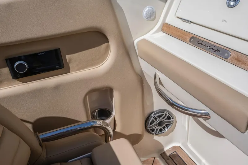 Chris-craft Launch 32 Yacht Photos Pics 2013 Chris-Craft Launch 32 interior with beige upholstery, chrome accents, and audio system.