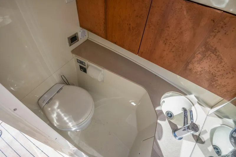 Chris-craft Launch 32 Yacht Photos Pics 2013 Chris-Craft Launch 32 boat bathroom with modern fixtures and wooden cabinetry.