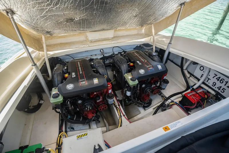 Chris-craft Launch 32 Yacht Photos Pics Engine compartment of 2013 Chris-Craft Launch 32 with twin engines, open hatch, and visible wiring.