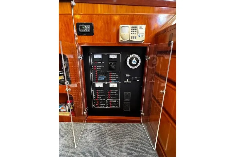 Gullwing Yacht Photos Pics Electrical panel inside 1998 Mikelson 43 Sportfisher yacht with open glass doors.