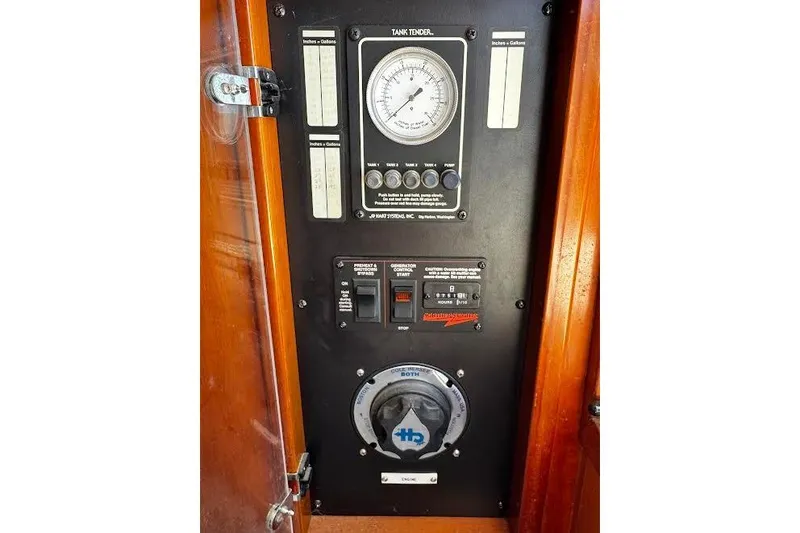 Gullwing Yacht Photos Pics Control panel of 1998 Mikelson 43 Sportfisher boat, featuring gauges and switches.