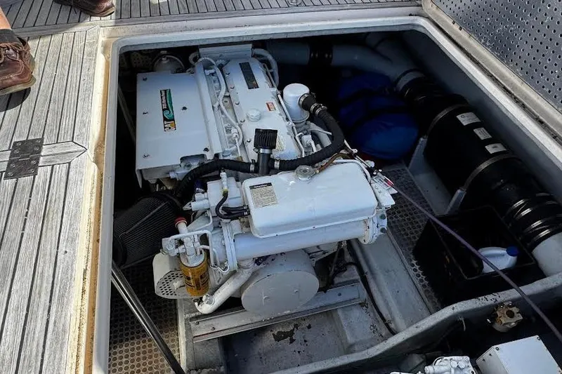 Gullwing Yacht Photos Pics Engine compartment of a 1998 Mikelson 43 Sportfisher boat, showcasing the engine details.