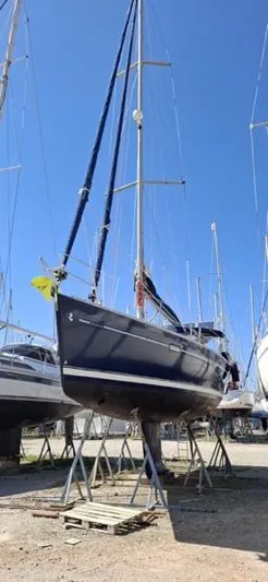  Yacht Photos Pics 2006 Beneteau Oceanis Clipper 393 sailboat on dry dock under clear blue sky.