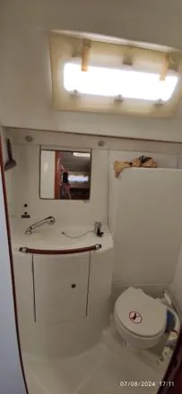  Yacht Photos Pics Bathroom interior of 2006 Beneteau Oceanis Clipper 393 yacht, featuring sink and toilet.