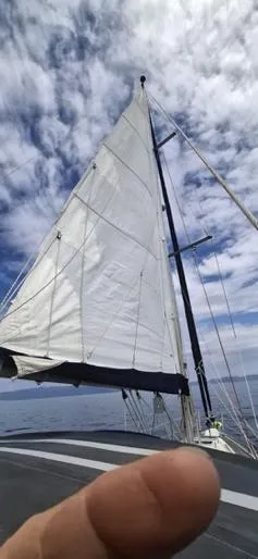  Yacht Photos Pics Sailing on a 2006 Beneteau Oceanis Clipper 393 under a cloudy sky.