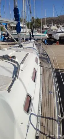  Yacht Photos Pics 2006 Beneteau Oceanis Clipper 393 sailboat docked, showcasing deck and cabin details.