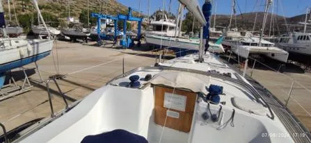  Yacht Photos Pics Beneteau Oceanis Clipper 393 sailboat docked in a marina, 2006 model.