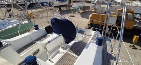  Yacht Photos Pics 2006 Beneteau Oceanis Clipper 393 sailboat deck view in a boatyard setting.