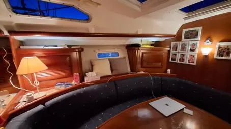  Yacht Photos Pics Interior of 2006 Beneteau Oceanis Clipper 393 yacht with cozy seating and decor.