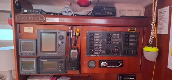  Yacht Photos Pics Control panel of a 2006 Beneteau Oceanis Clipper 393 sailboat, featuring navigation and communication equipment.