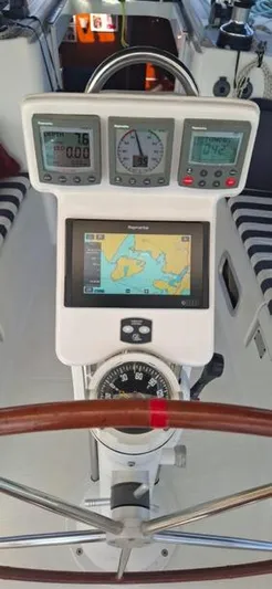  Yacht Photos Pics Cockpit of 2006 Beneteau Oceanis Clipper 393 with navigation instruments and steering wheel.