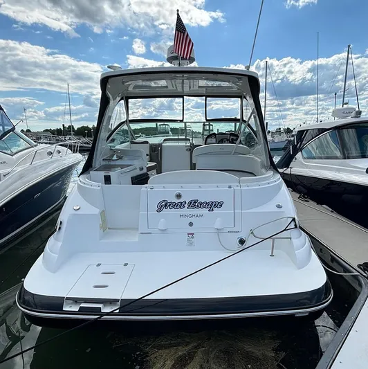  Yacht Photos Pics 2011 Cruisers Yachts 330 Express docked, rear view with American flag.