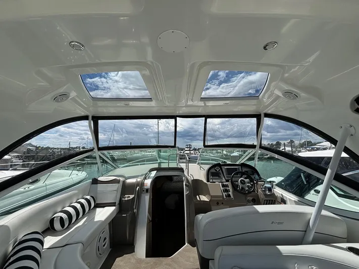  Yacht Photos Pics Interior of 2011 Cruisers Yachts 330 Express with panoramic windows and plush seating.