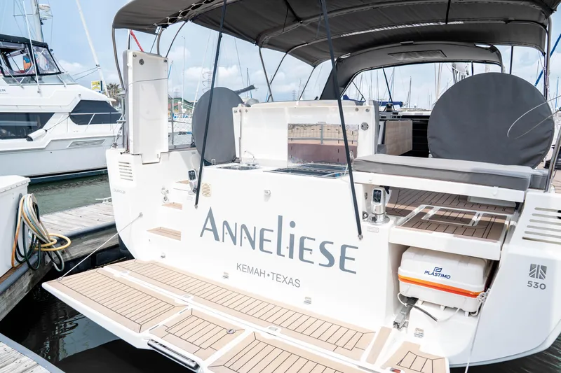  Yacht Photos Pics 2023 Dufour 530 yacht docked, featuring spacious deck and modern amenities.