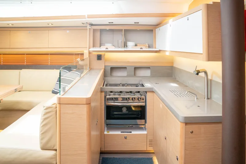  Yacht Photos Pics Modern kitchen interior of 2023 Dufour 530 yacht with sleek design and amenities.