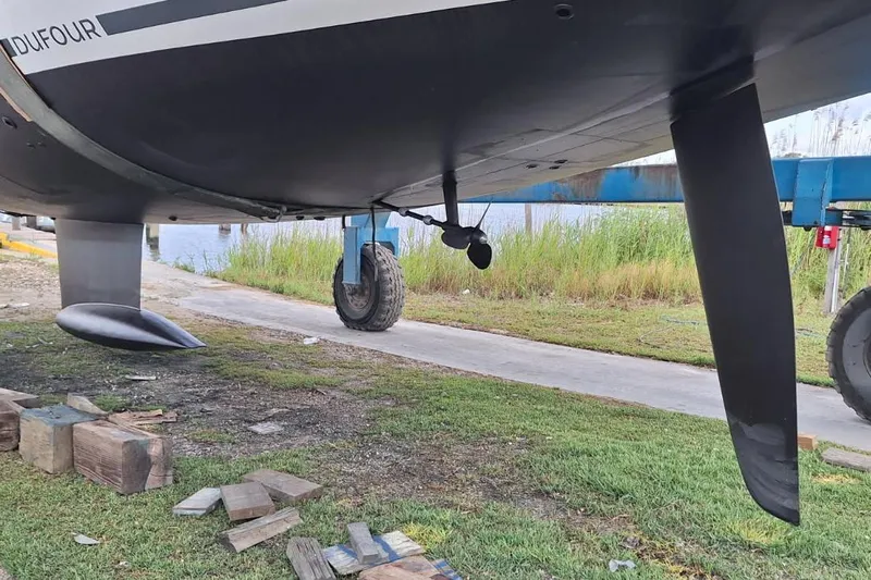  Yacht Photos Pics Underwater view of 2023 Dufour 530 sailboat hull and rudder on land.