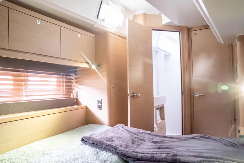  Yacht Photos Pics Luxurious interior of 2023 Dufour 530 yacht cabin with modern wood finish.