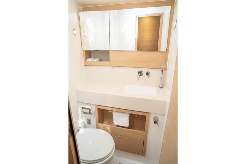  Yacht Photos Pics Modern bathroom in 2023 Dufour 530 yacht, featuring sleek design and wooden accents.