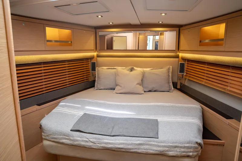  Yacht Photos Pics Luxurious cabin interior of 2023 Dufour 530 yacht with cozy bed and modern design.
