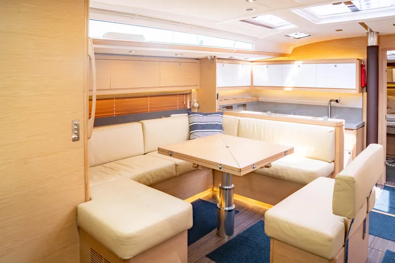  Yacht Photos Pics Luxurious interior of 2023 Dufour 530 yacht with modern seating and dining area.