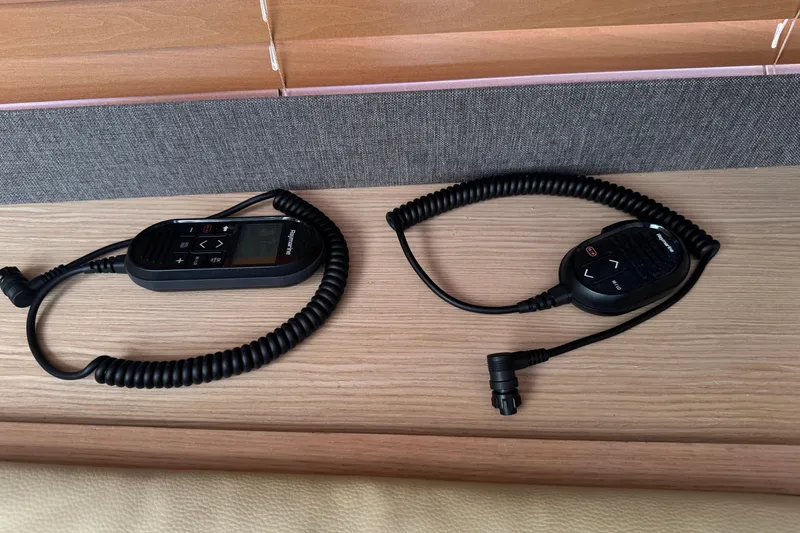  Yacht Photos Pics Remote controls on a wooden surface inside a 2023 Dufour 530 yacht.