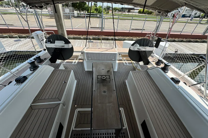  Yacht Photos Pics 2023 Dufour 530 yacht cockpit with dual steering wheels and teak decking.