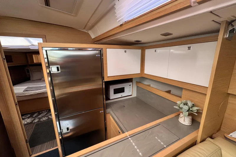  Yacht Photos Pics Modern kitchen interior of 2023 Dufour 530 yacht with stainless steel appliances.