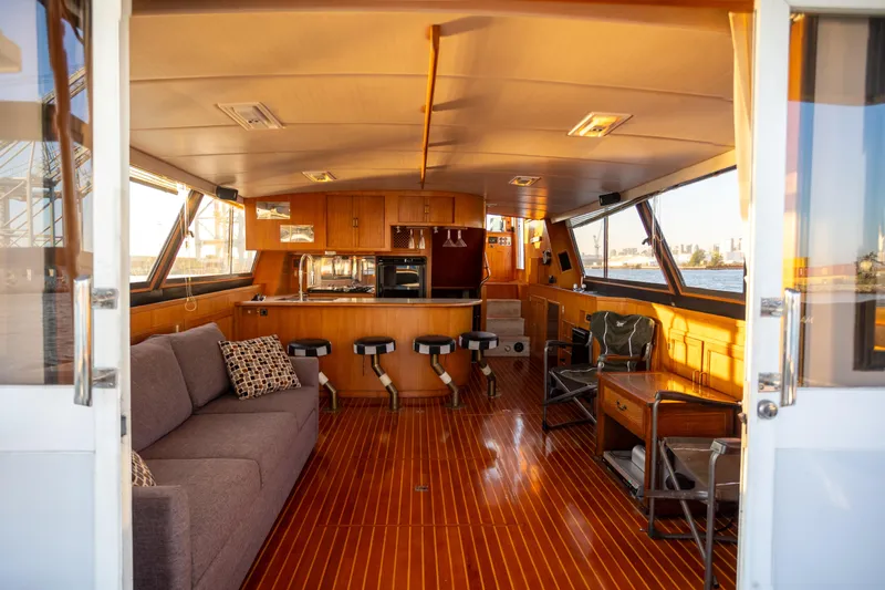Mbellish Yacht Photos Pics Interior of 1988 Symbol 51 Motoryacht with wooden flooring and modern furnishings.