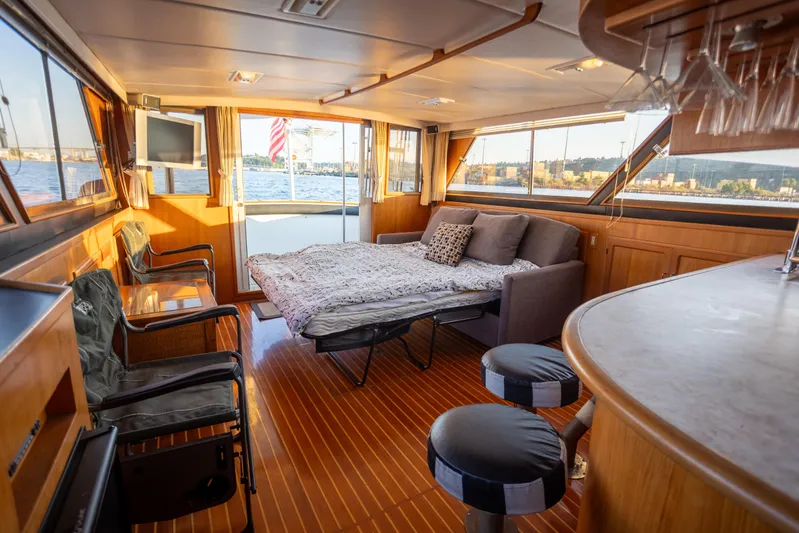 Mbellish Yacht Photos Pics Luxurious interior of 1988 Symbol 51 Motoryacht with sofa bed and bar area.