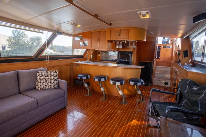 Mbellish Yacht Photos Pics Luxurious 1988 Symbol 51 Motoryacht interior with modern kitchen and seating area.
