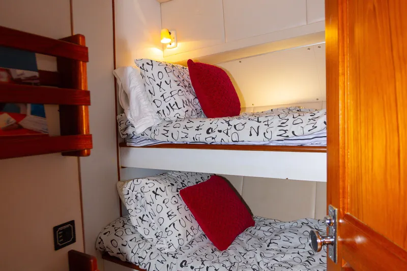 Mbellish Yacht Photos Pics Bunk beds with alphabet-themed bedding in 1988 Symbol 51 Motoryacht cabin.
