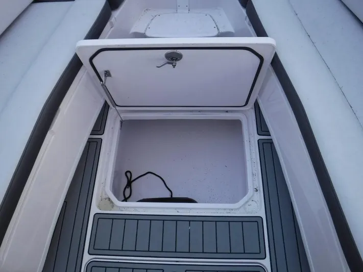  Yacht Photos Pics Open storage compartment on 2018 Fountain 34CC boat deck.