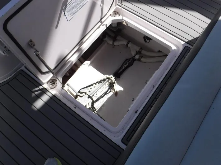  Yacht Photos Pics Open storage compartment on 2018 Fountain 34CC boat deck.