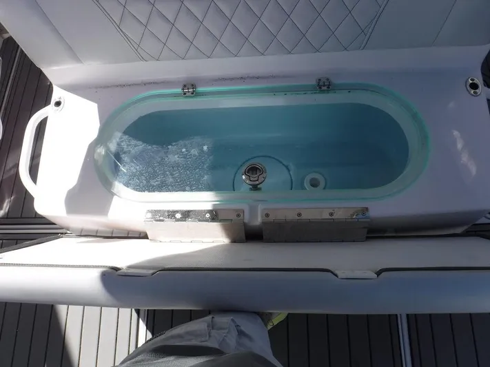  Yacht Photos Pics Livewell on 2018 Fountain 34CC boat, featuring a sleek design and practical functionality.