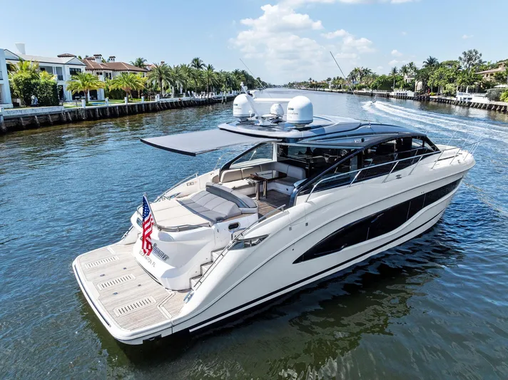 Endless Summer Yacht Photos Pics Luxury 2020 Princess V55 yacht cruising on a scenic waterway.