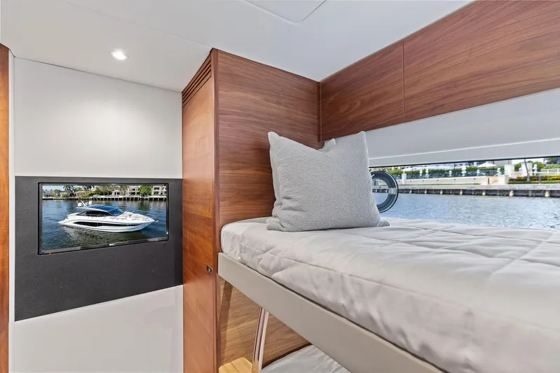 Endless Summer Yacht Photos Pics Interior of 2020 Princess V55 yacht with bunk bed and window view.