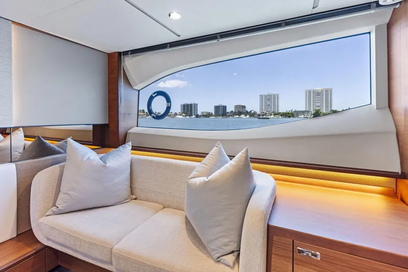 Endless Summer Yacht Photos Pics Luxurious interior of 2020 Princess V55 yacht with scenic window view.