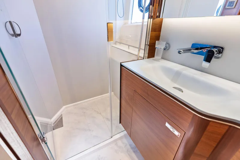 Endless Summer Yacht Photos Pics Modern bathroom in 2020 Princess V55 yacht with sleek sink and shower.
