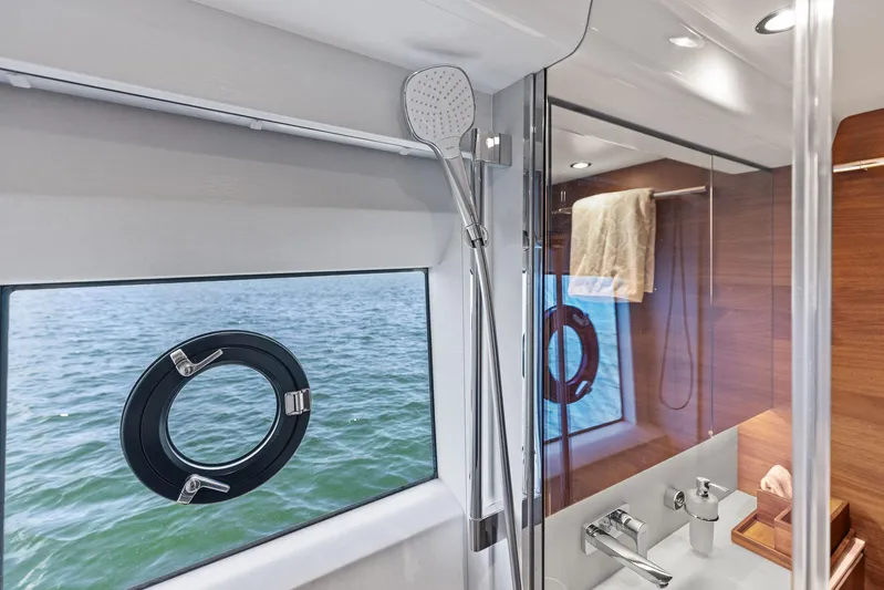 Endless Summer Yacht Photos Pics Luxurious bathroom interior of 2020 Princess V55 yacht with ocean view.